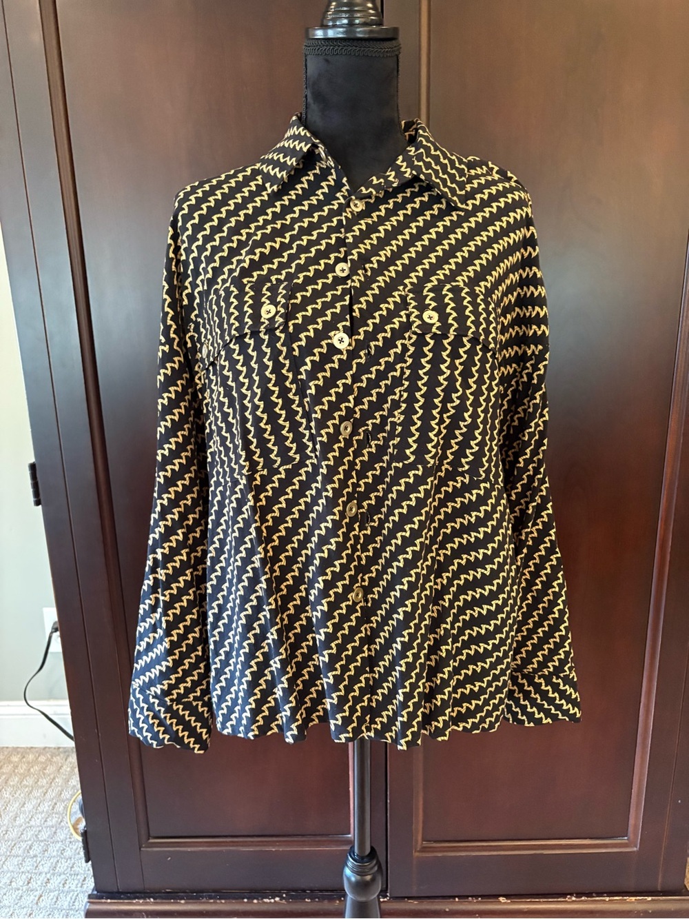 Women’s black and gold button up